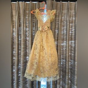Like new flower girl lace dress with separate floral sash around empire waist.